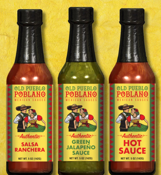 Three bottles of Poblano brand sauce