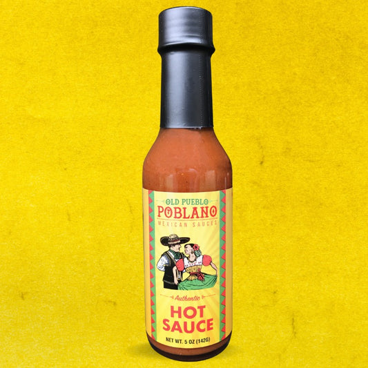 Bottle of Old Pueblo Poblano hot sauce on a yellow background